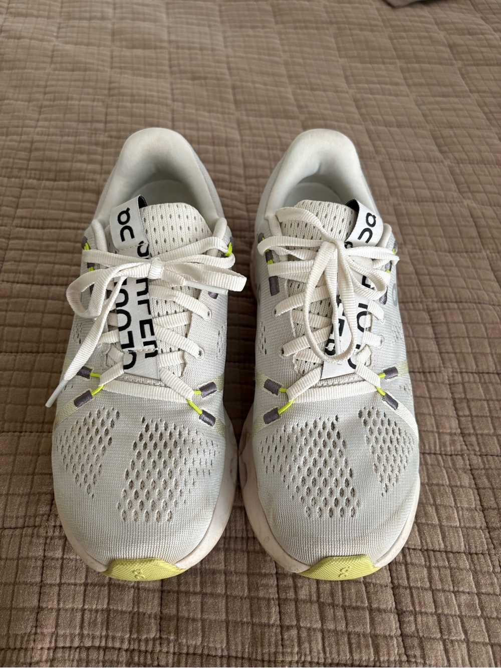 On Running White Sneakers with Yellow Accents